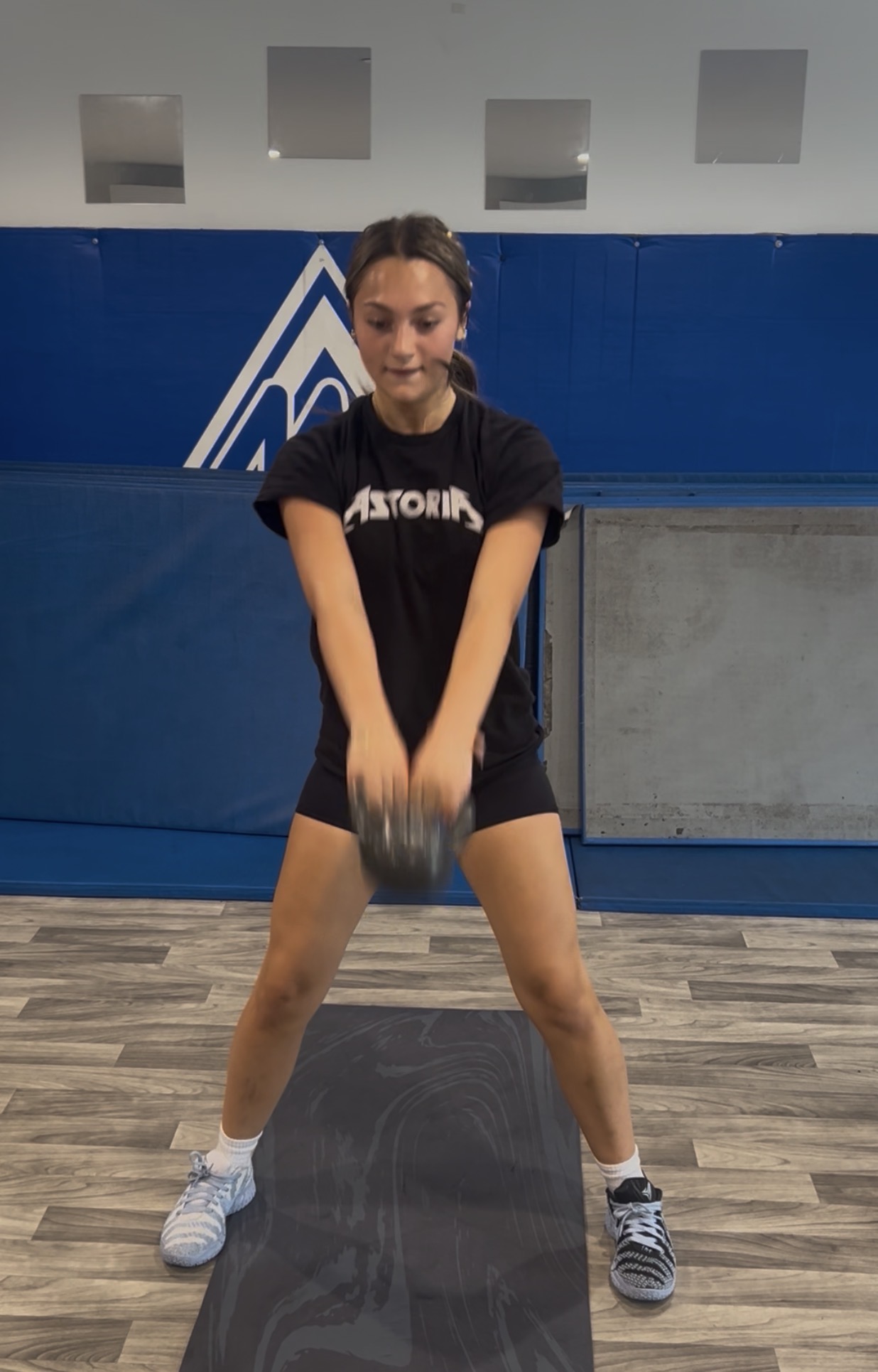 Athlete performing an explosive kettlebell swing