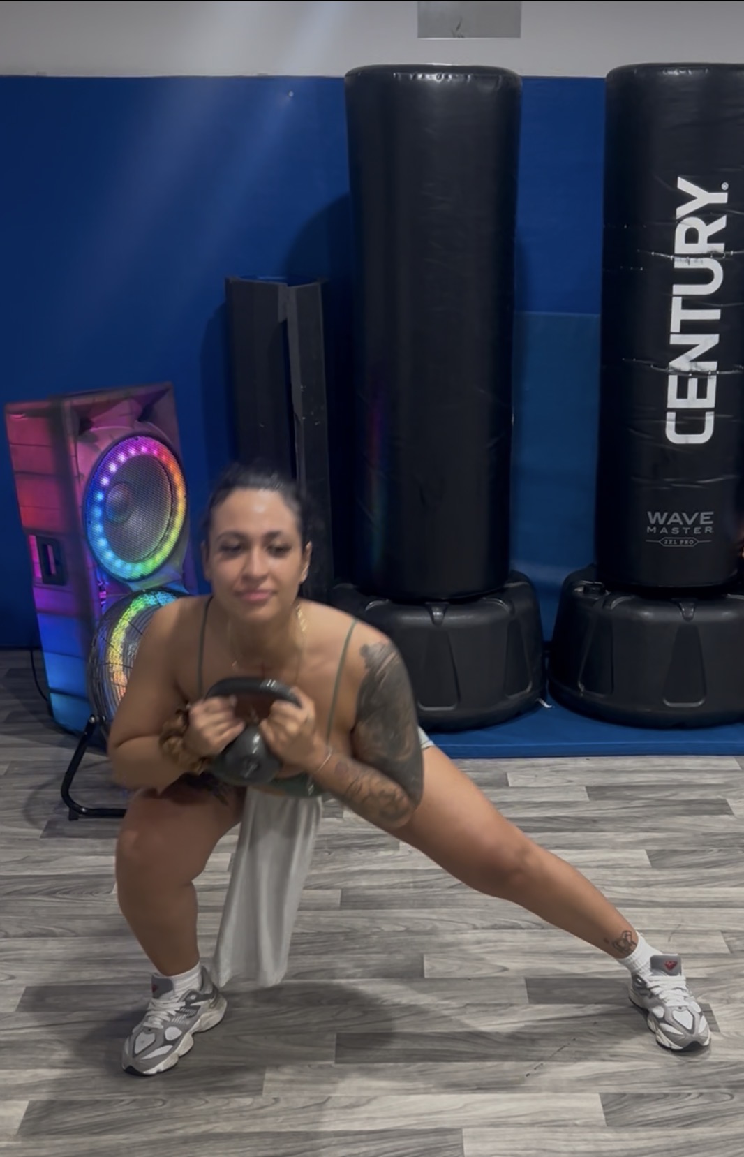 Athlete in a loaded lateral lunge with kettlebell